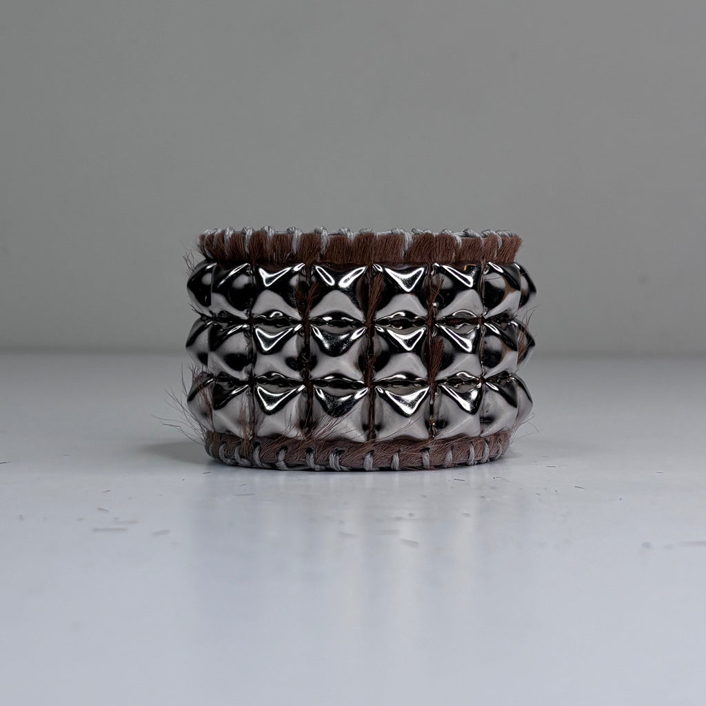 PONY HAIR-ON HIDE WITH CHROME PYRAMID STUDS