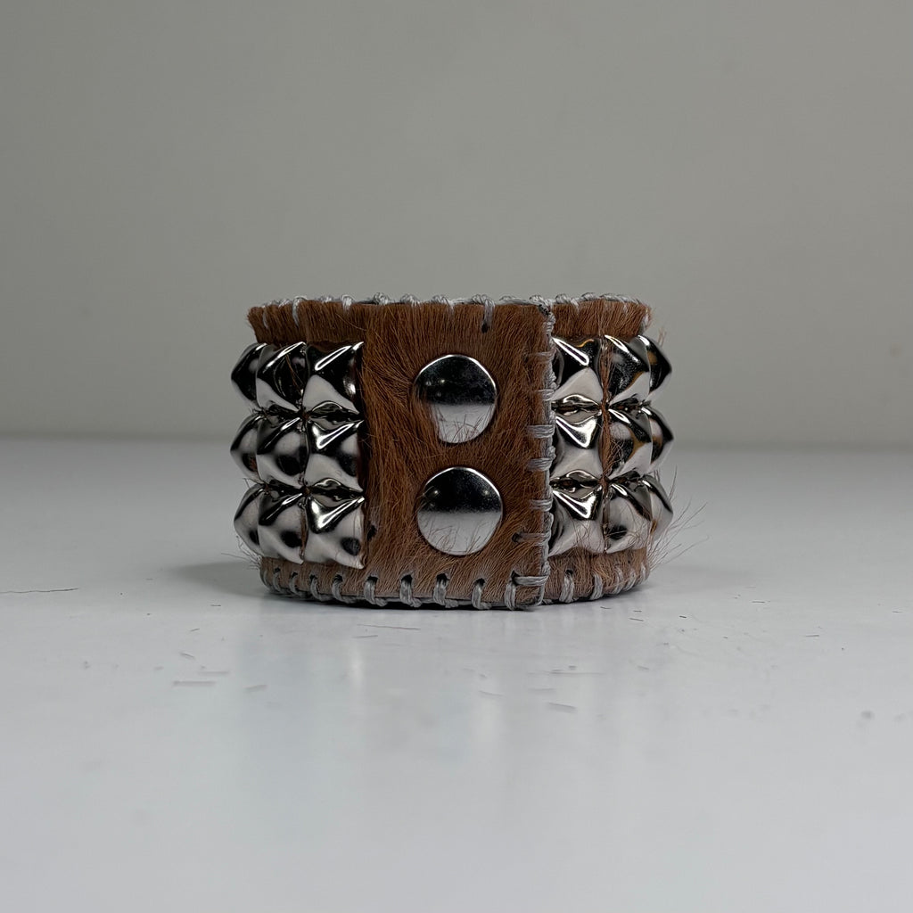 PONY HAIR-ON HIDE WITH CHROME PYRAMID STUDS