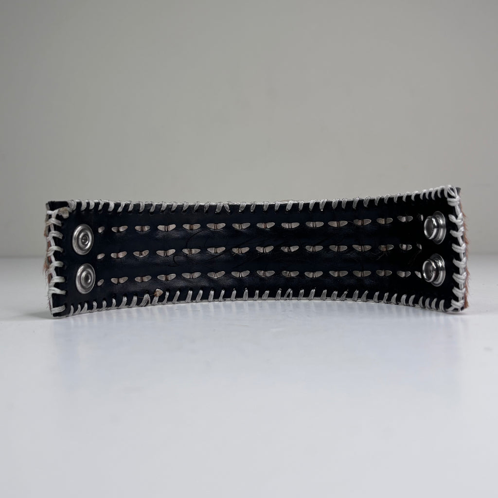 PONY HAIR-ON HIDE WITH CHROME PYRAMID STUDS