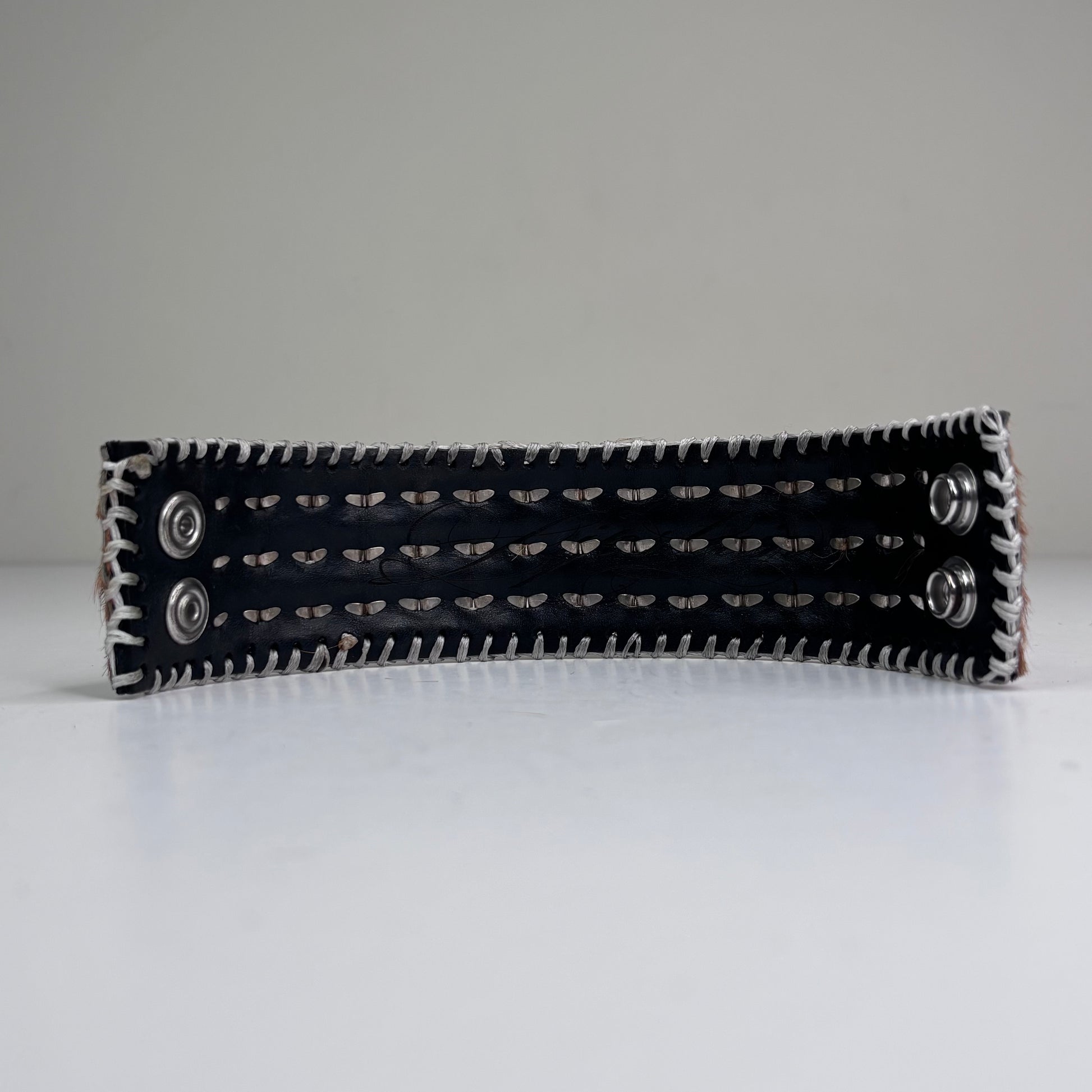 PONY HAIR-ON HIDE WITH CHROME PYRAMID STUDS